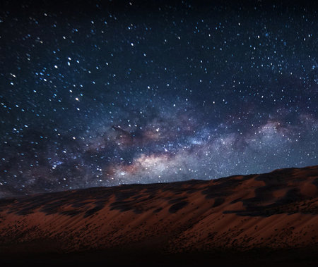 Milky Way over sand dunes in the Sahara desert, Moroccoの写真素材
