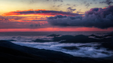 Sunset over the sea of clouds in the Carpathian mountains