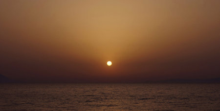 Beautiful sunset over the sea. Sunset over the sea. The sun goes down.の写真素材
