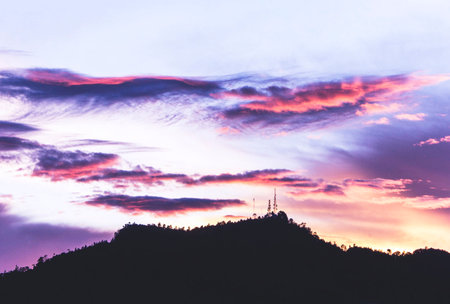 Silhouette of a mountain at sunset with beautiful sky background.の写真素材