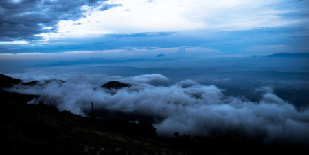 Mountain landscape with clouds and fog at Phu Chi Fa, Chiang Rai, Thailandの写真素材