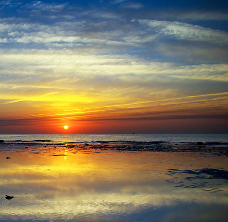 Sunset over the sea. Beautiful nature background. Sunset on the beach.の写真素材