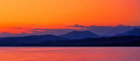 Sunset over the lake with mountains in the background, Crete, Greeceの写真素材