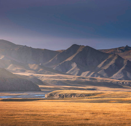 Mountain landscape at sunset. Kazakhstan. Tien Shan. Assy plateau