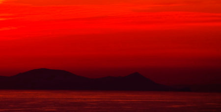 Red sunset over the sea in the summer. Crimea, Ukraine.