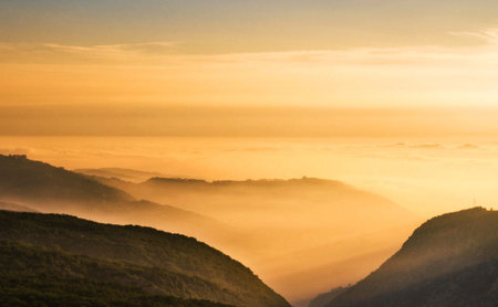 Mountain landscape with fog and sunrise at Phu Kradueng National Park, Loei, Thailandの写真素材