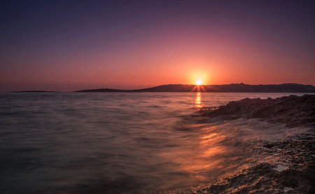 Sunset on the beach of the Adriatic Sea in Croatiaの写真素材