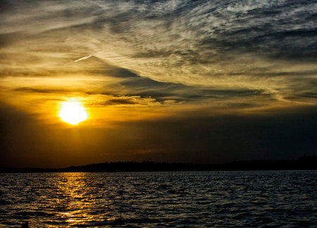 Sunset on the lake. Beautiful sunset on the lake. The sun sets over the lake.の写真素材