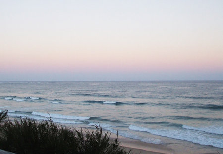 Beautiful sunset on the beach in Algarve, Portugal.の写真素材