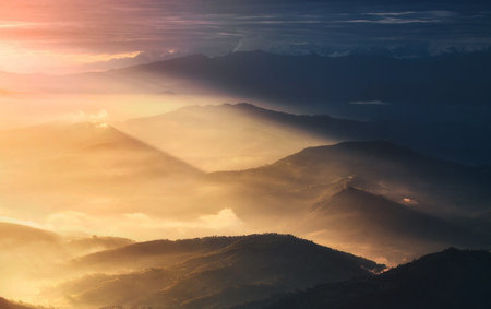 Beautiful sunrise over the mountain range in morning light, Thailand.の写真素材