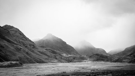 Black and white image of a mountain landscape in Scotland, UK.