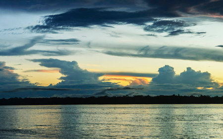 colorful dramatic sky with cloud at sunset near the river, nature seriesの写真素材