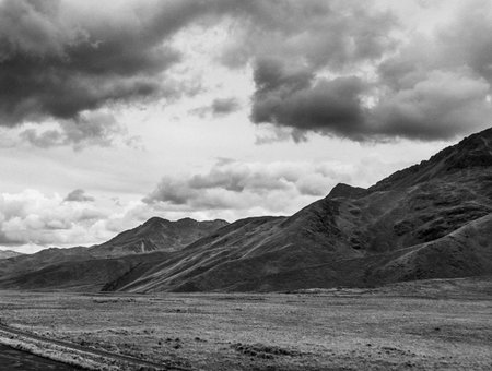 Mountain landscape with cloudy sky. Black and white. Kyrgyzstan.