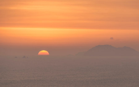 Sunset over the sea and islands in Phuket, Thailandの写真素材