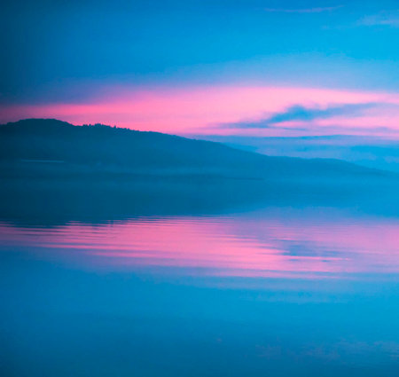 Colorful sunrise on the lake in the mountains. Beautiful nature background