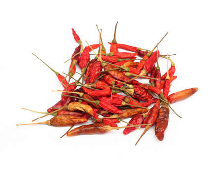 dried hot chili peppers isolated on a white background の写真素材