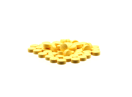 tablets scattered on a white backgroundの写真素材