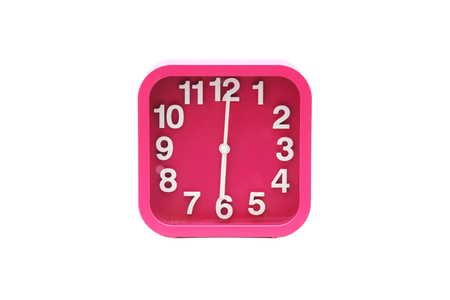 Alarm clock pink colour on isolated white backgroundの写真素材