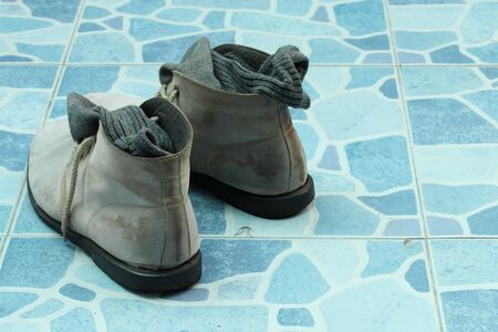 men shoes on tiled floor.