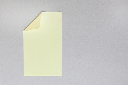 Yellow stick note on gray background
