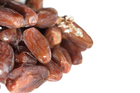 Dried dates (Phoenix dactylifera l) isolated on white backgroundの写真素材