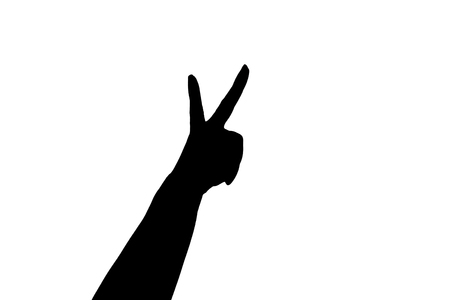 Silhouette of Symbol of victory. Hand isolated on white backgroundの写真素材