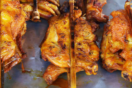 yellow chicken grilledの写真素材