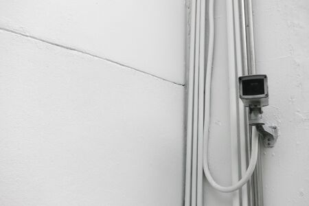 security camera on the white wallの写真素材
