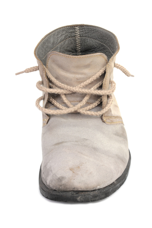 Old gray men shoe isolated on white backgroundの写真素材