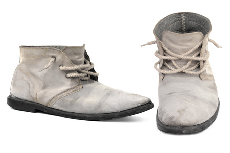 Old gray men shoes isolated on white backgroundの写真素材