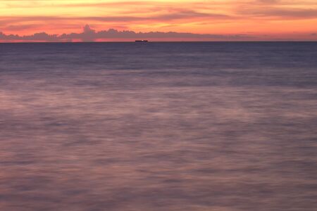 Long exposure photo of the beach dramatic in the eveningの写真素材
