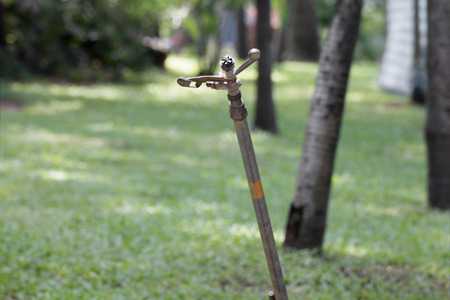 Metal automatic water sprinkler in the garden.の写真素材