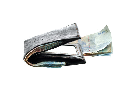 Money in black leather wallet isolated on white background.の写真素材