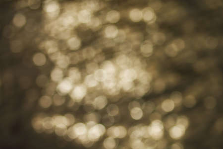 Defocused gold abstract bokeh background.の写真素材