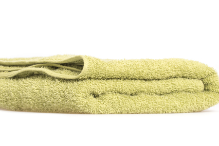 Green body towel isolated on white backgroundの写真素材