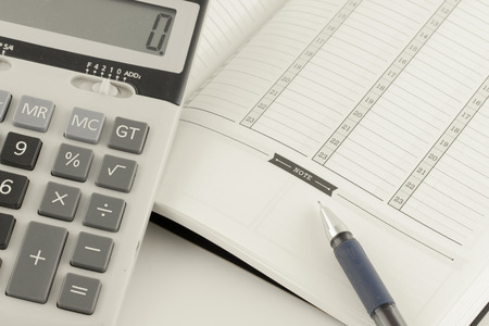 Education concept : Calculator and pen on notebook.の写真素材