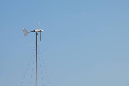 Wind turbines against the blue sky.の写真素材