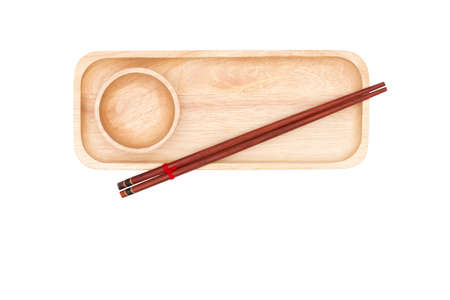 Top view : wooden chopsticks and wooden cup placed on the wooden tray isolated on white background.の写真素材