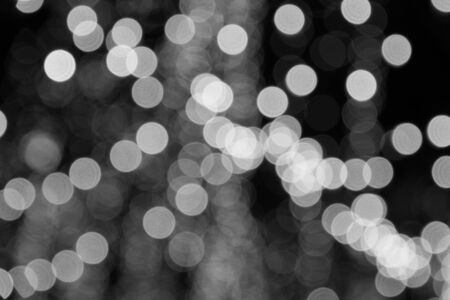Abstract bokeh lights. defocused background - black and white tone.
