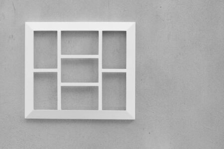 Empty wooden white picture frame on cement wall.の写真素材