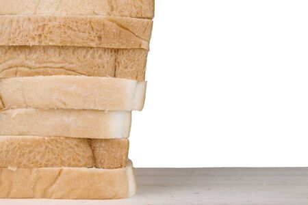 Whole wheat bread on wooden table isolated on white background.