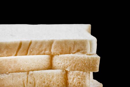 Whole wheat bread isolated on black background.