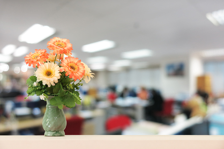 Flower bouquet with abstract blur office background.の写真素材