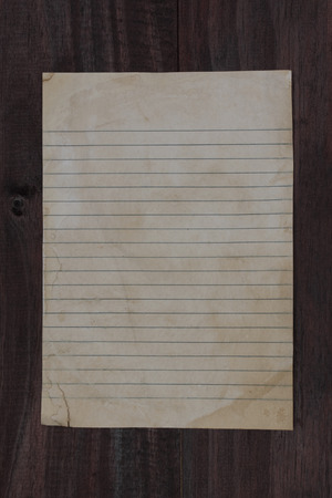 old paper on wooden background.の写真素材