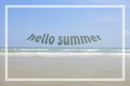 Hello summer text with blur beach and sea.の写真素材