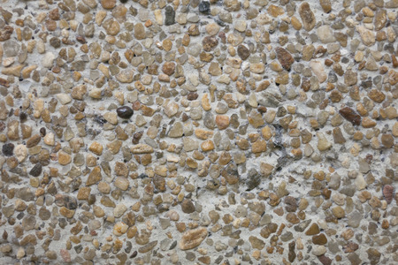 Abstract background of small pebbles embedded in cementの写真素材