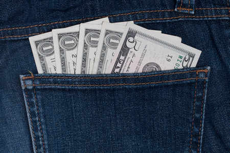 Dollars in a pocket of jeans