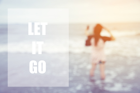 Inspirational quote with blurred background of woman on the beach - inspiring creative motivationの写真素材