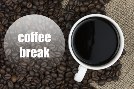 coffee break. text of coffe beans and coffee cup backgroundの写真素材