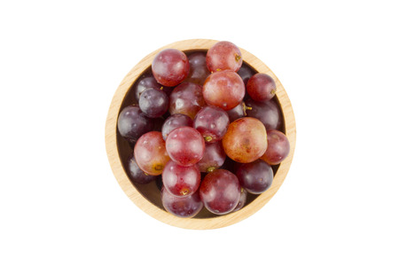 fresh red grape in bowl isolated on white background - clipping pathの写真素材